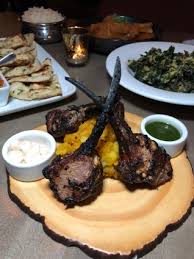 Veda Modern Indian Bistro signature dishes Butter ChickenLamb ChopsTandoori Salmon